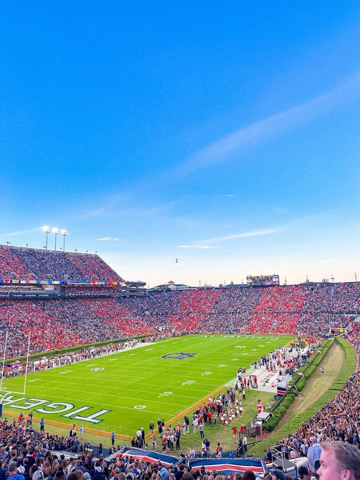 Jordan-Hare Stadium packed with fans before kickoff under a clear blue sky