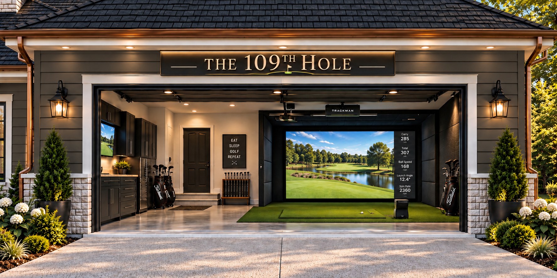 The 109th Hole simulator garage open to the drive, Trackman screen lit inside